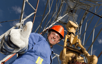 Oil drill maintenance worker gives a thumbs up 