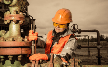 Maintenance worker makes adjustments to equipment 