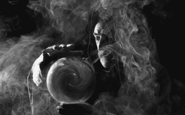 Man making a ball of smoke with his hands 