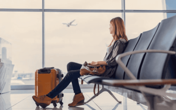 Airline passenger waits in a terminal 