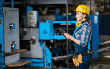 Maintenance worker looks over live digital maintenance request