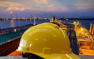 Hardhat sitting in front of an enterprise facility 