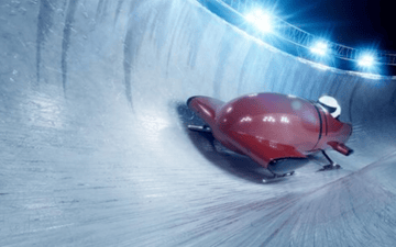 Two man bobsled during a run 