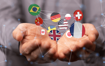 Man holding a web of connected country flags 